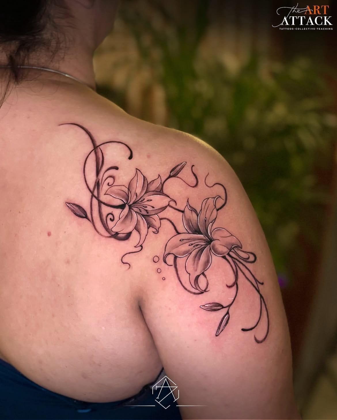 Fine-line forearm tattoo combining anatomical and geometric elements.